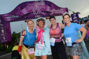 Kimberly, Gail, Rebecca, and Pam at the finish of the 2014 Enchanted 10K [this photo made the runDisney official race photo album]